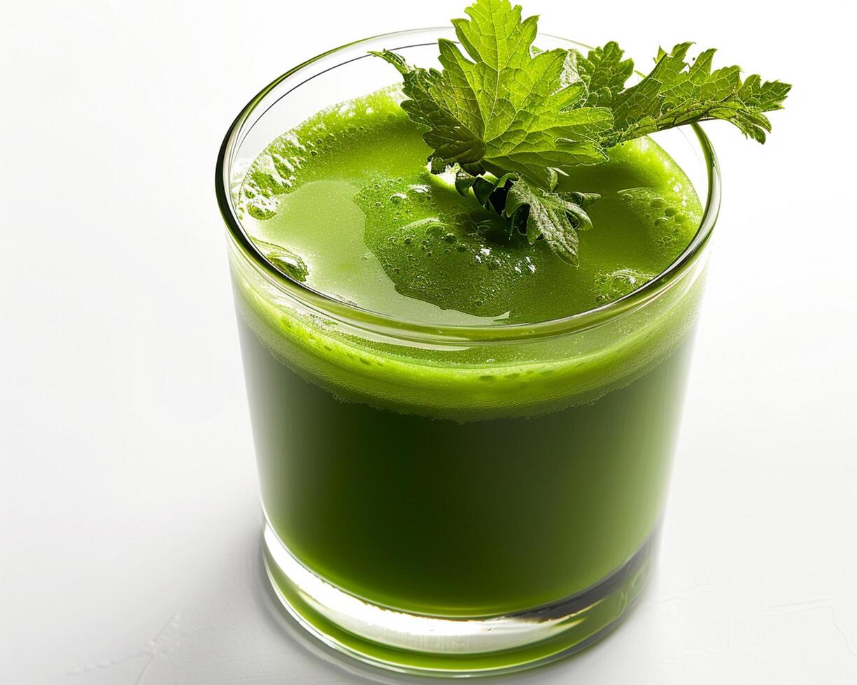 a glass of green juice photo