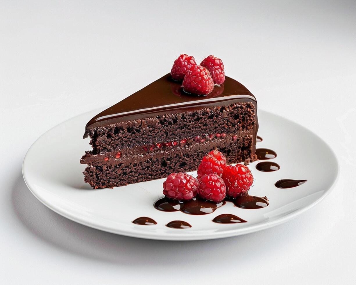 a piece of chocolate cake with raspberries on top photo