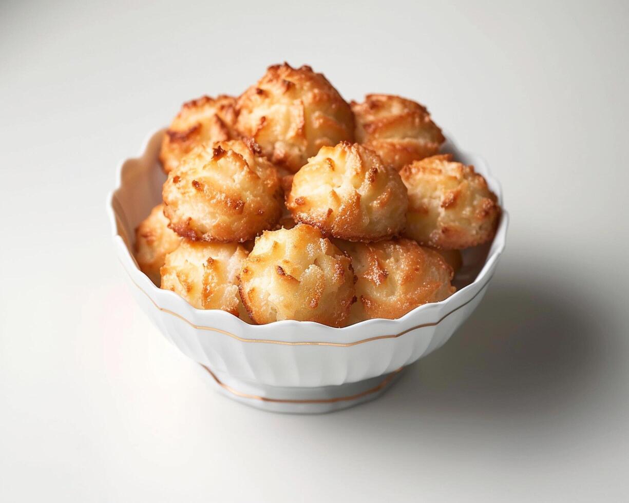 a bowl of baked goods sitting on a table photo