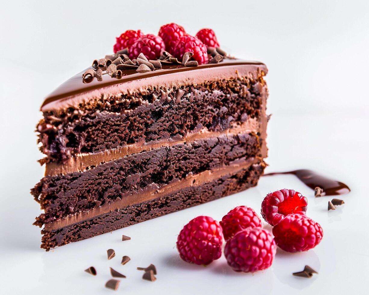 a piece of chocolate cake with raspberries on top photo