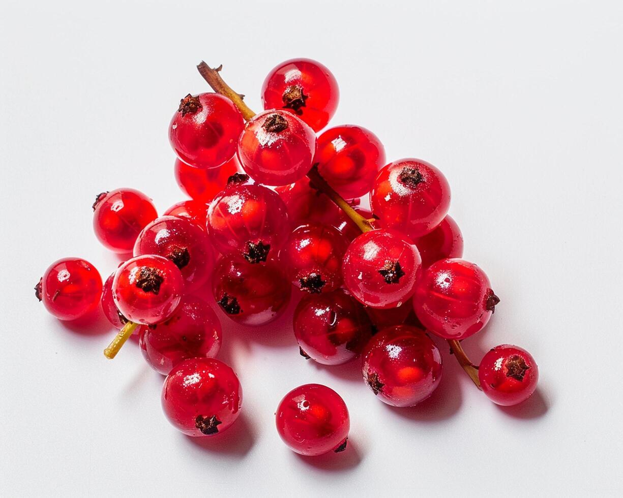 a bunch of red curranberries on a white surface photo