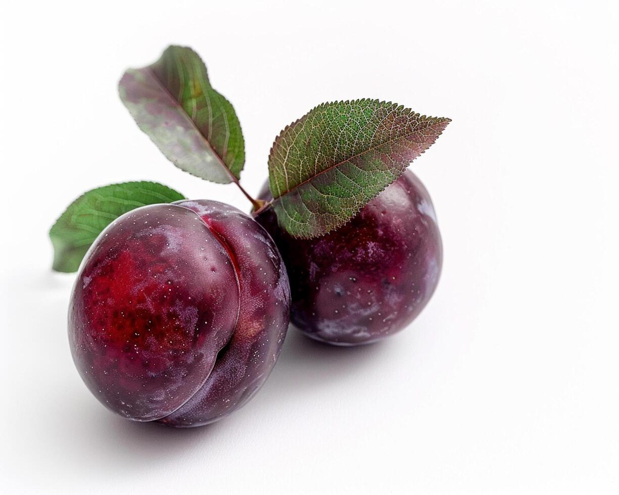 two plums on a white background photo