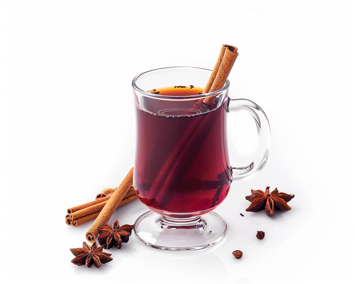 a glass of mulled wine with cinnamon and star anise photo