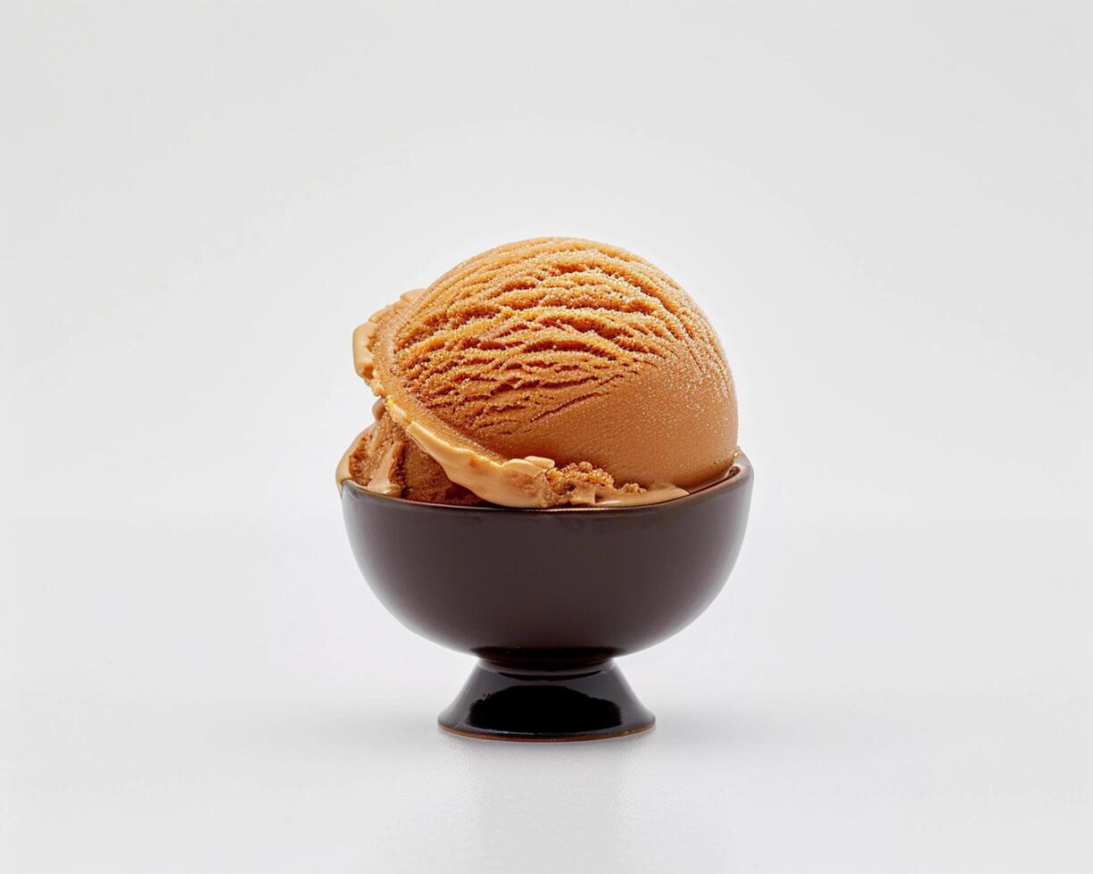 a scoop of ice cream in a black bowl photo