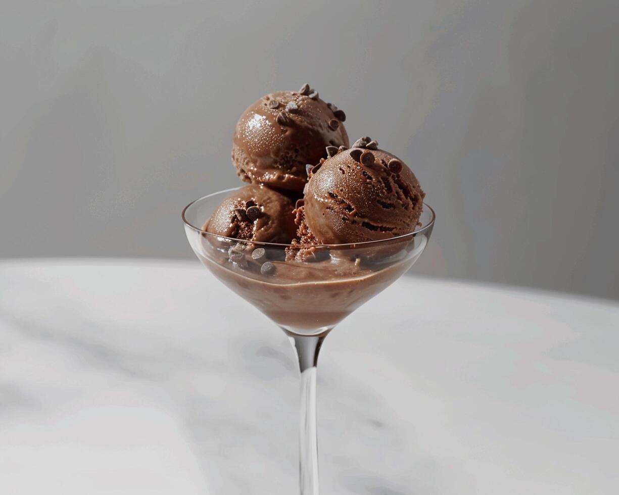 chocolate ice cream in a glass with chocolate chips photo