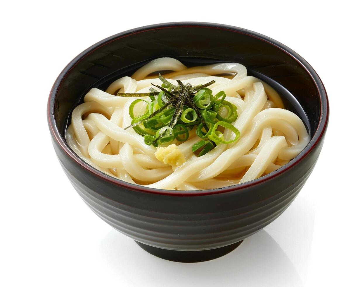 a bowl of noodles with green onions and a spoon photo