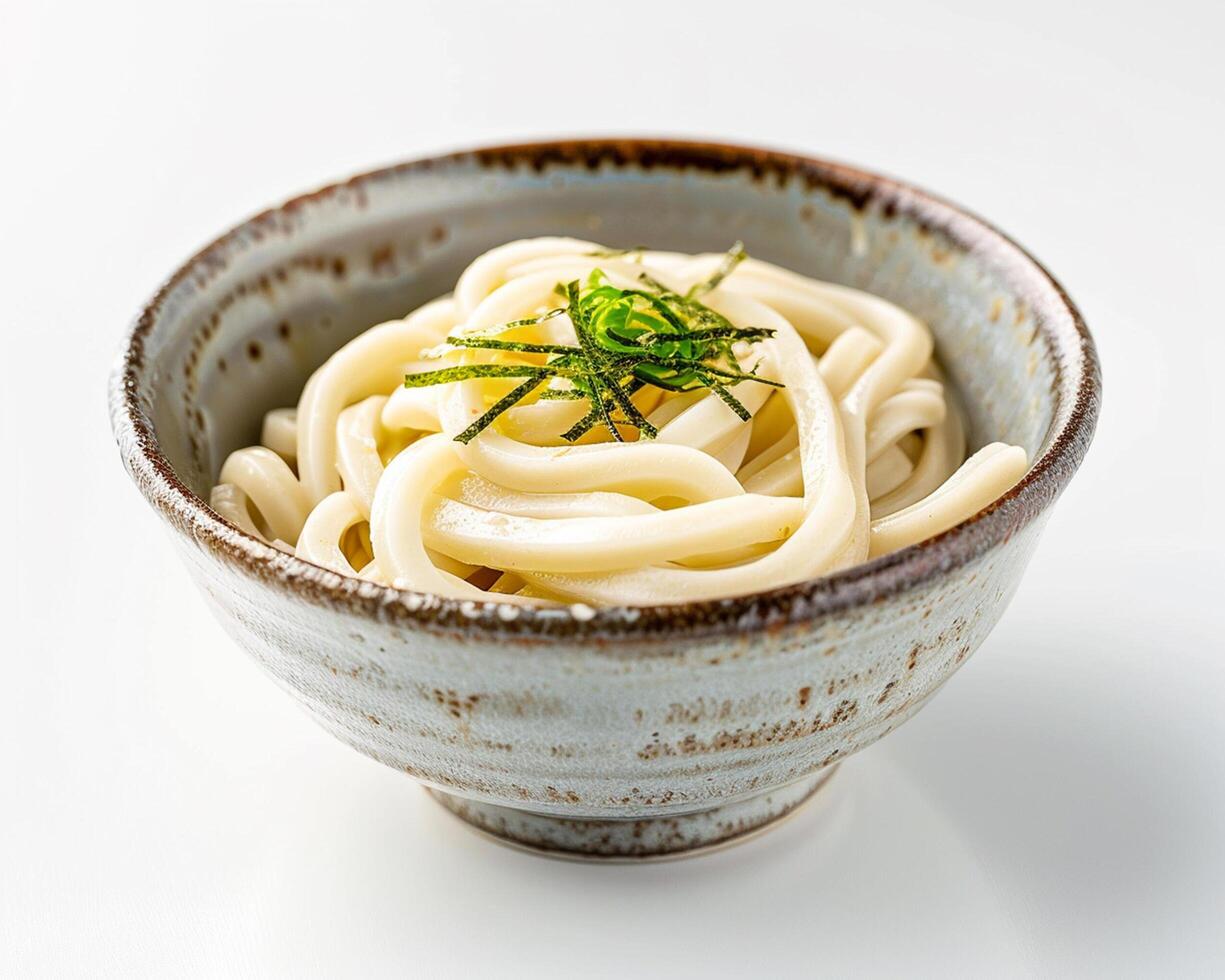 a bowl of noodles with a garnish of herbs photo