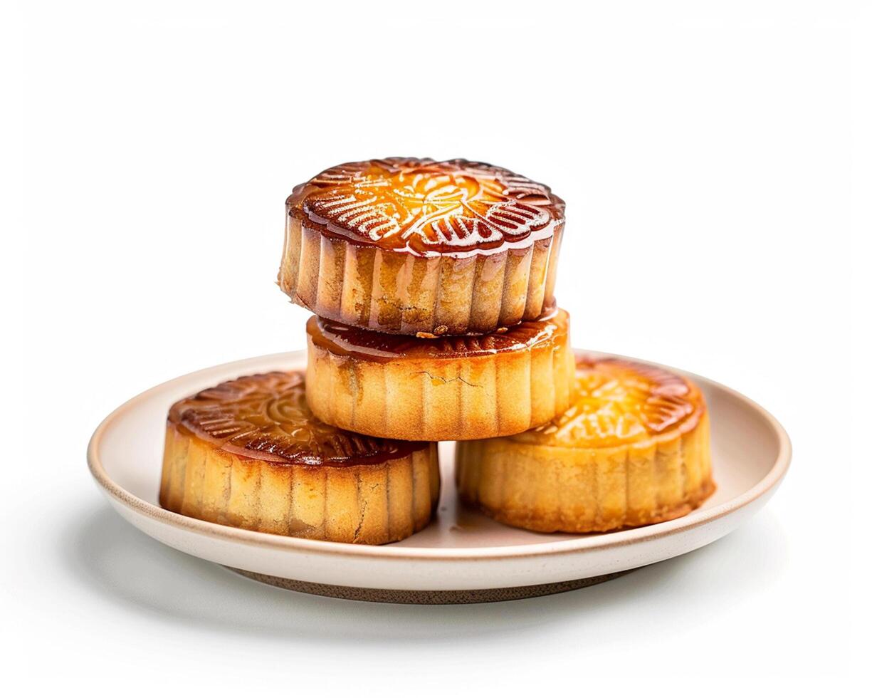 a plate of three small cakes sitting on top of each other photo