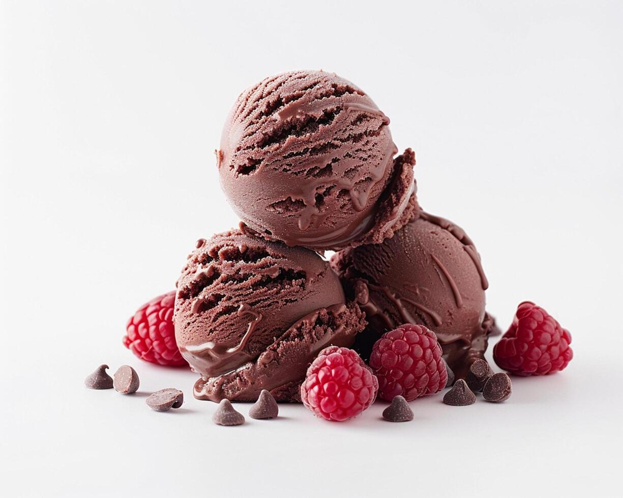 three scoops of chocolate ice cream with raspberries photo