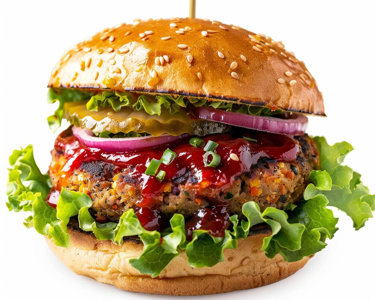 a hamburger with ketchup and lettuce on top photo