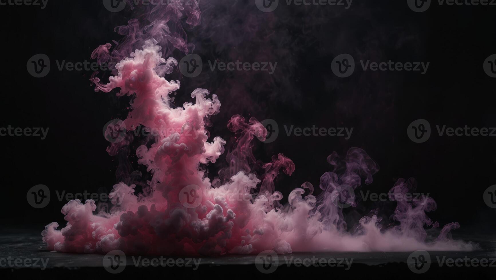 A pink smoke cloud on a black background photo