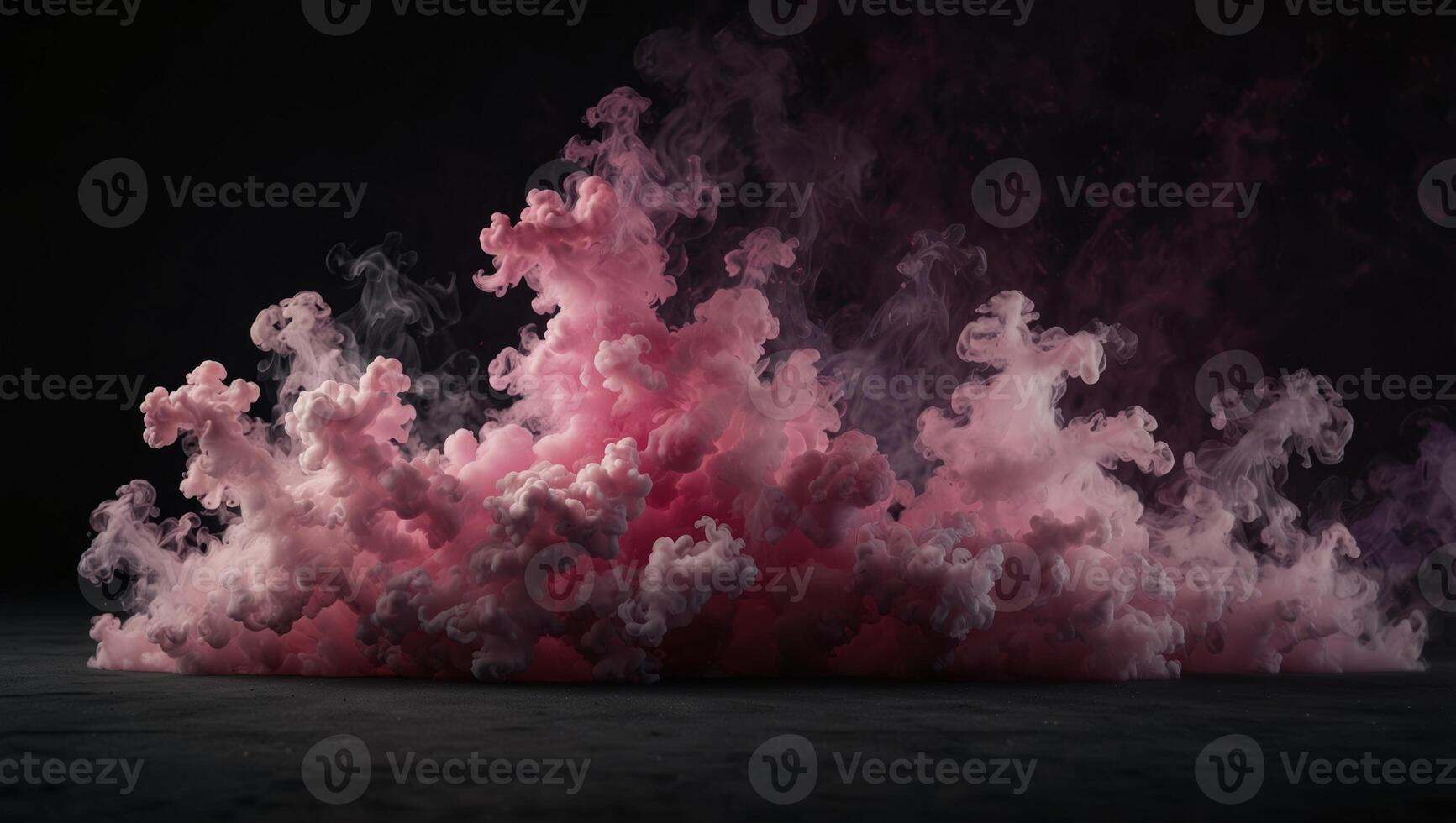 A pink smoke cloud on a black background photo