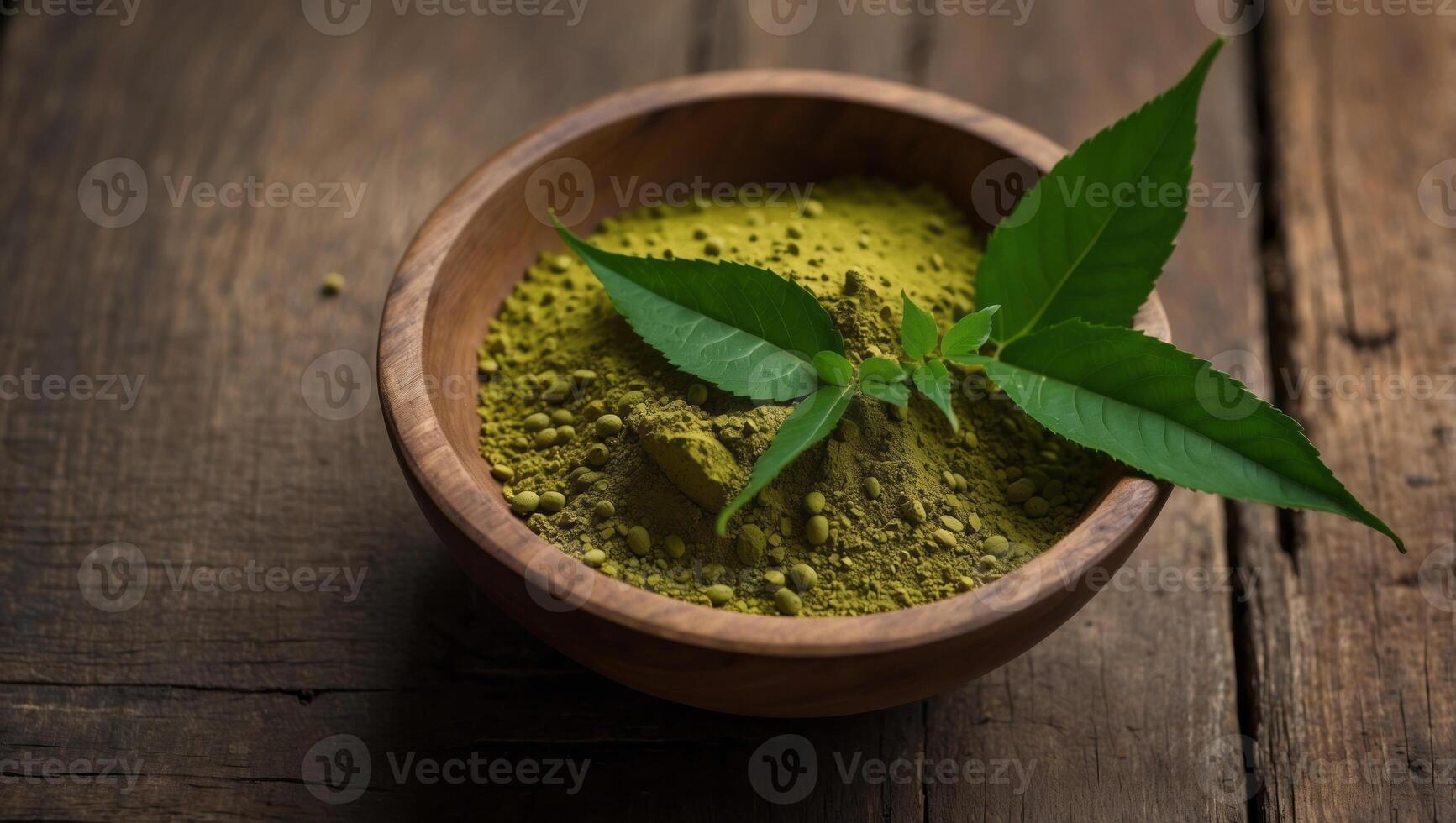 Mitragyna Speciosa Korth or kratom powder on wooden bowl wtih capsules and green leaf on rustic wooden background, top view and copy space. photo