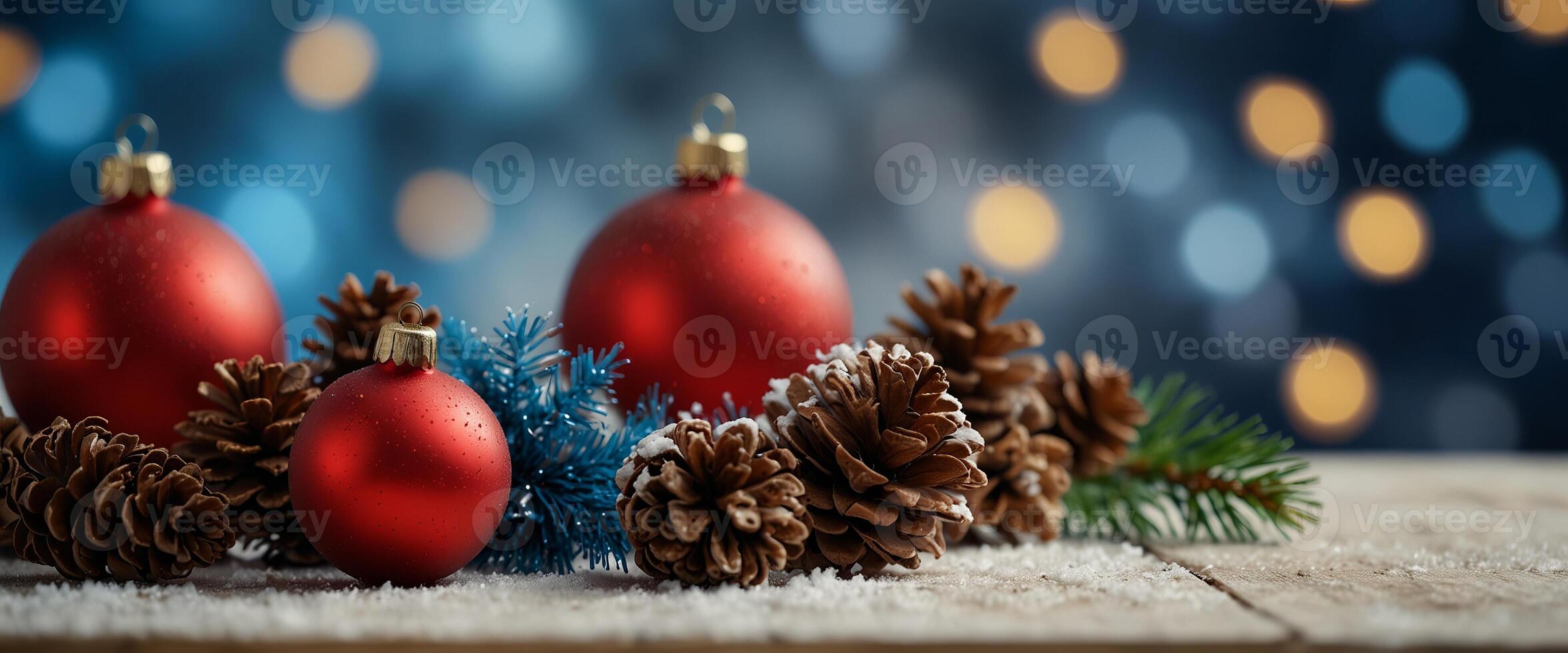 Christmas - Banner Of Red Ornament, Pine-cones And Branches On Snowy Wooden Table With Blue Bokeh Background. photo