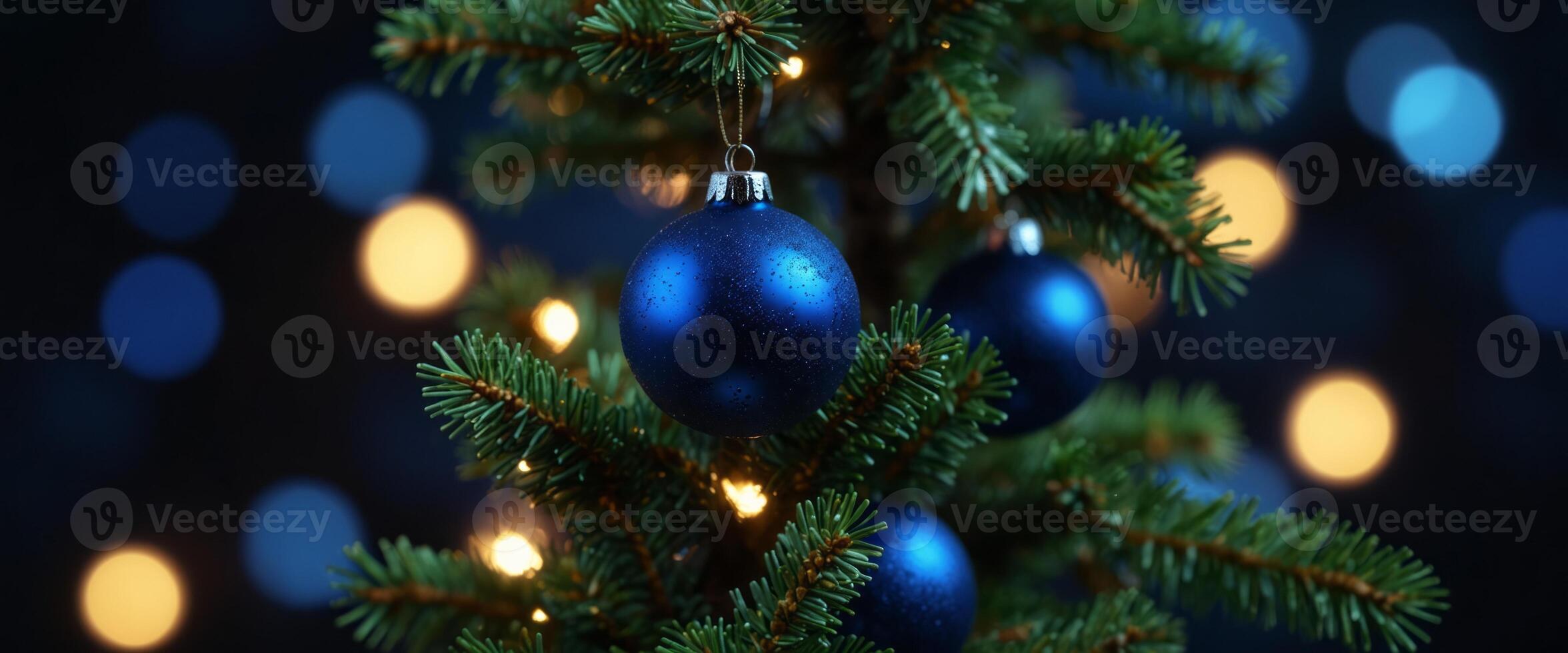 Christmas Tree With Baubles In Blue Night - Ornaments On Fir Branches With Glittering And Defocused Lights In Abstract Background. photo