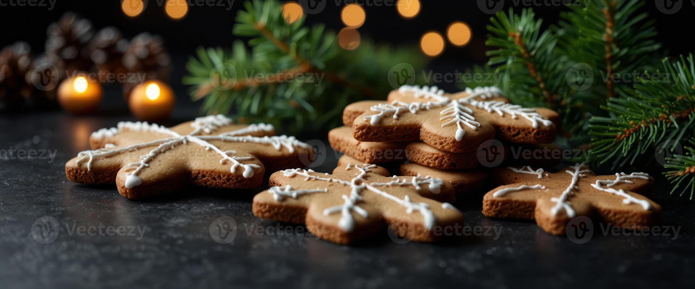 Christmas background with homemade gingerbread cookies, evergreen branches and decorations on black table Festive food, New Year celebration traditions. photo