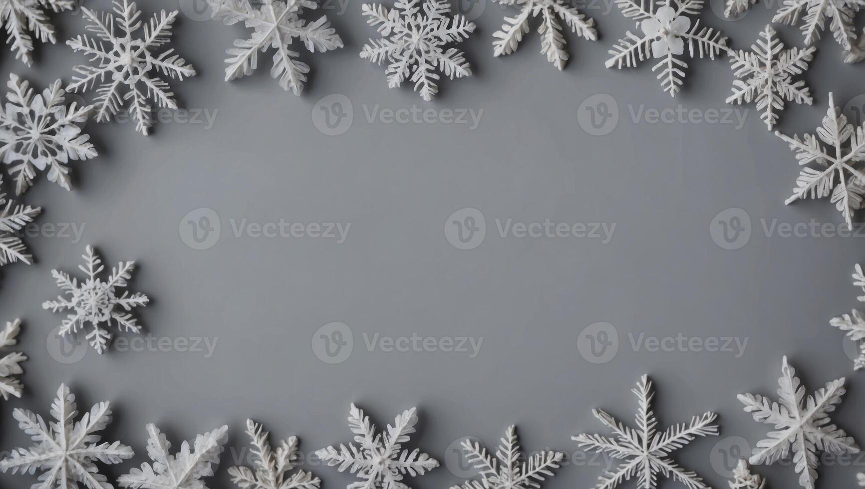 Christmas composition Frame made of snowflakes on pastel gray background Christmas, winter, new year concept Flat lay, top view, copy space. photo