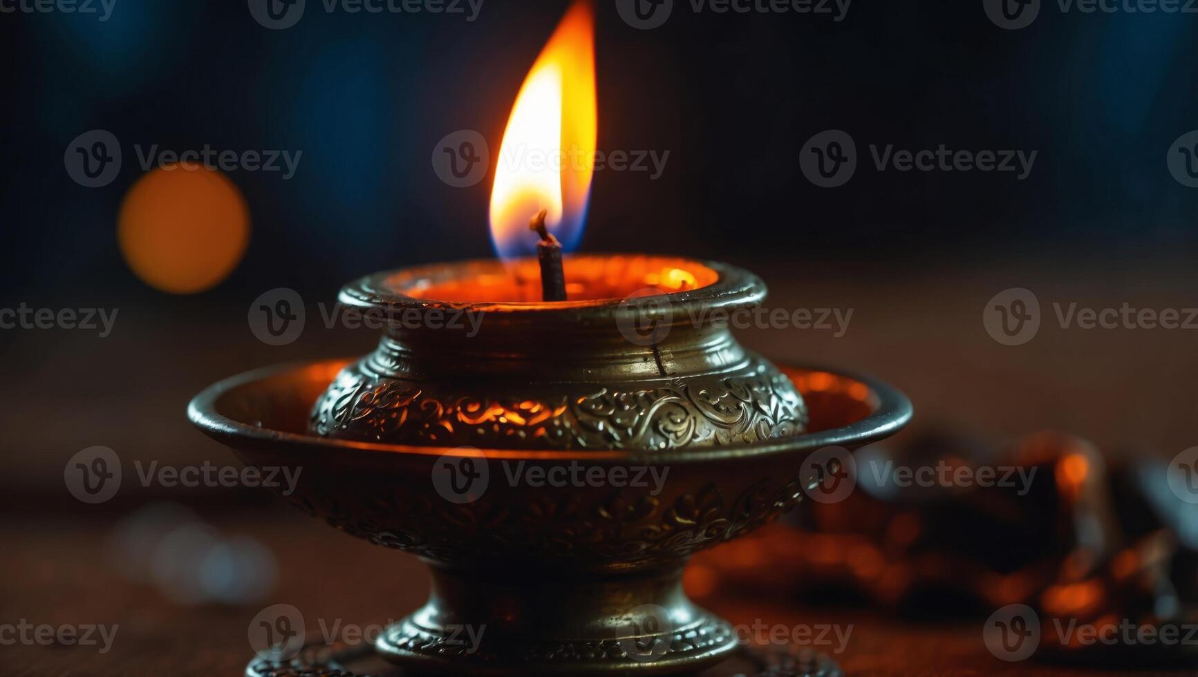 Closeup shot of a burning traditional Sri Lankan oil lamp. photo