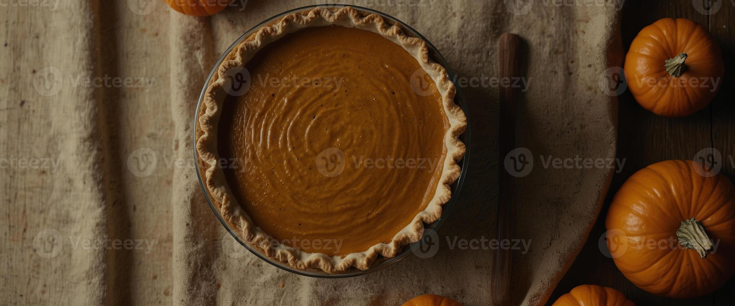 Process of making Pumpkin pie for Thanksgiving Day View from above Seasonal traditional autumn festive cake. photo