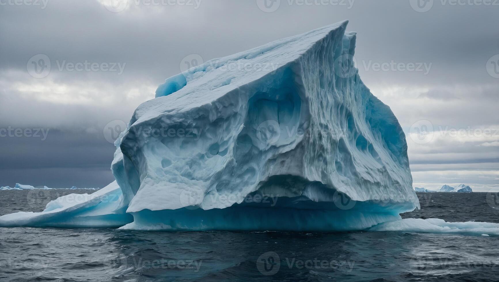 A large iceberg floats in the vast ocean waters, showcasing the immense power and beauty of natures icy formations. photo