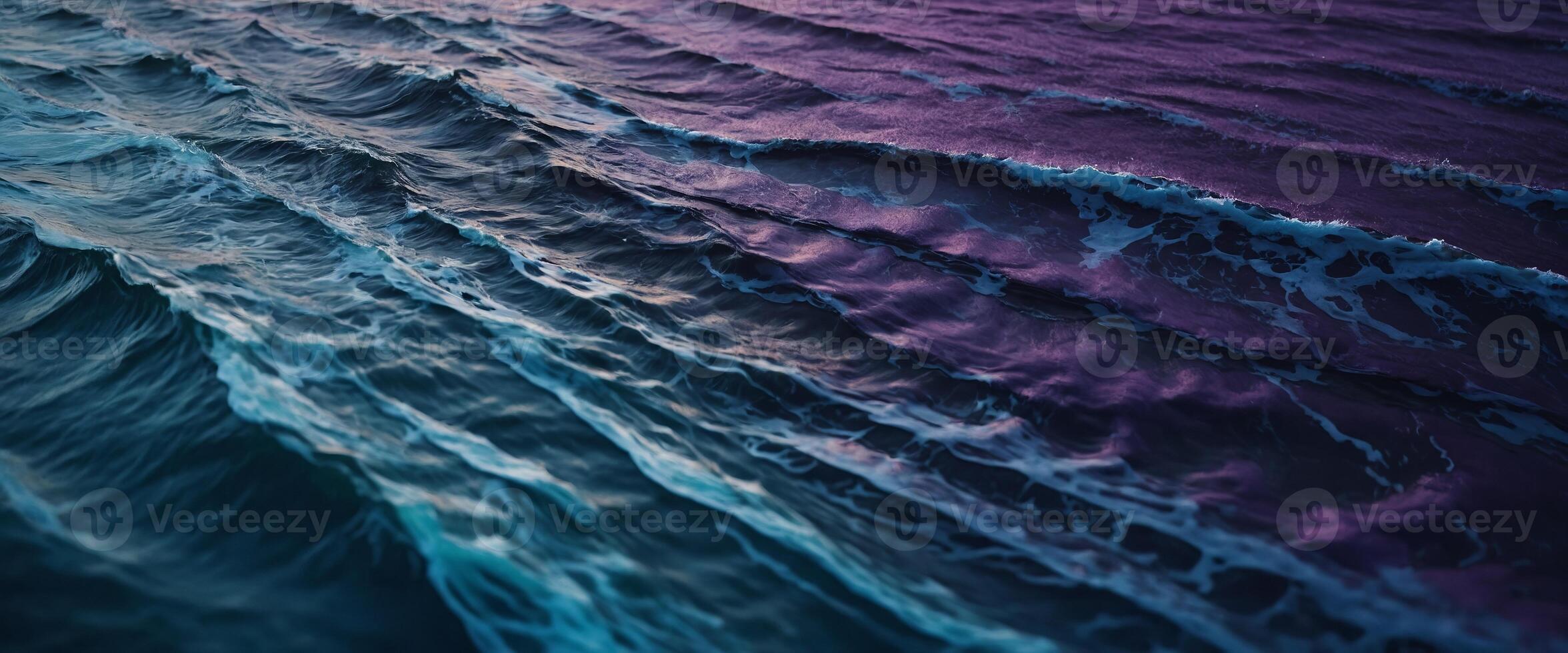 Abstract rough textures in blue and purple evoke the wild beauty of ocean waves, rendered in complementary colors for a dramatic art piece. photo