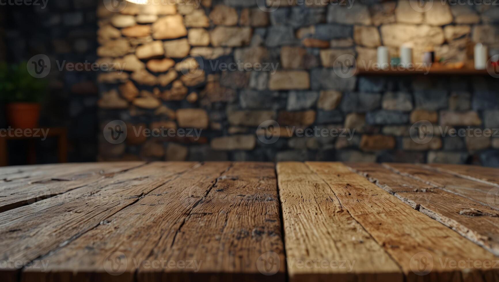Wooden table on wild stone cladding wall background, rustic lounge area interior design. photo