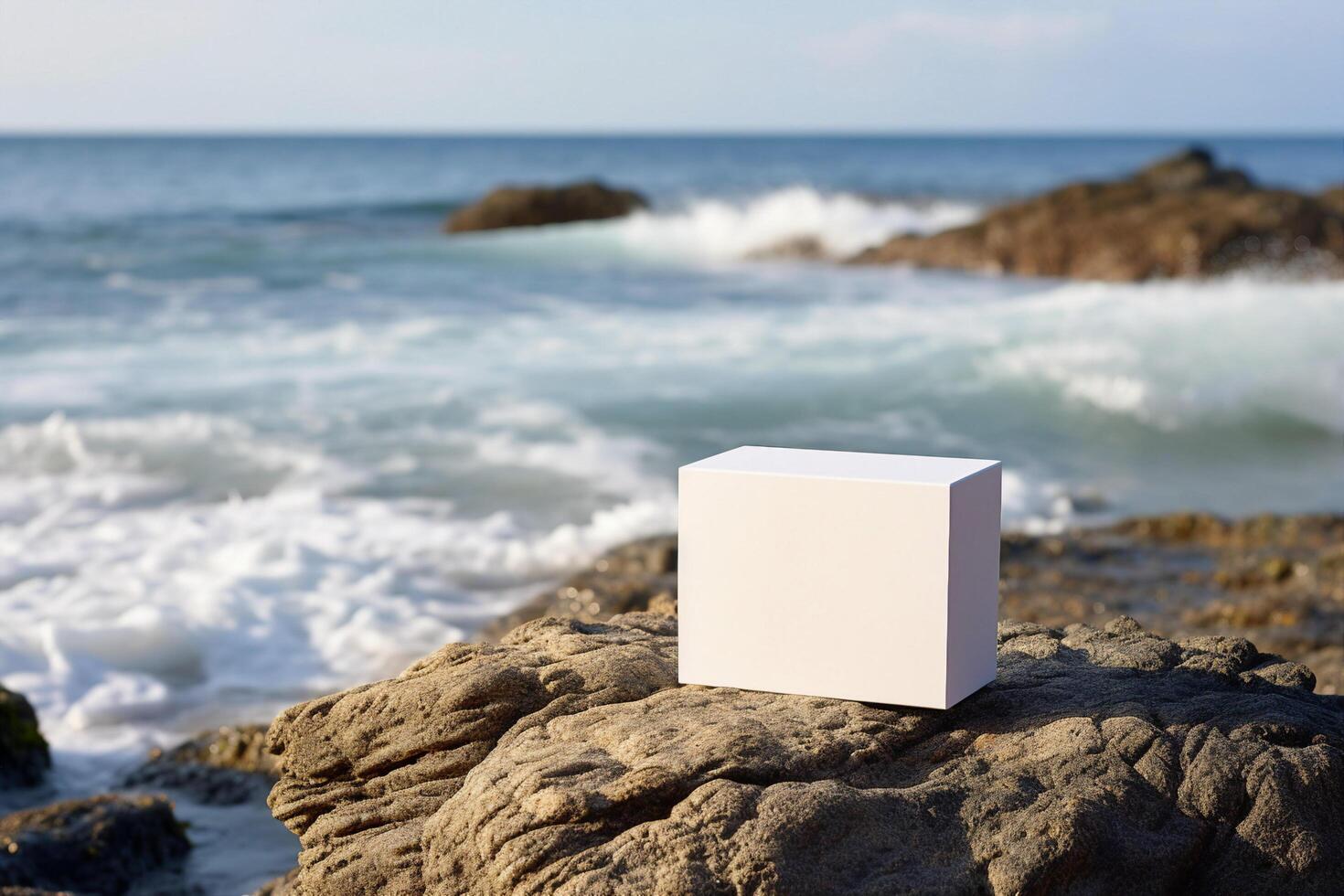 white box on a stone in a sea beach photo