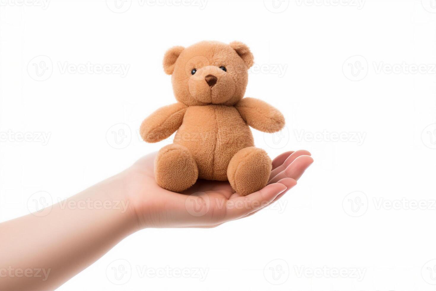 hand hold brown toy bear photo