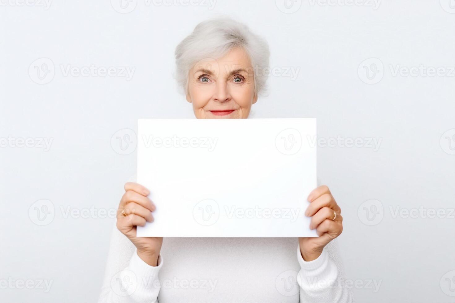 senior old woman hold blank paper on white photo