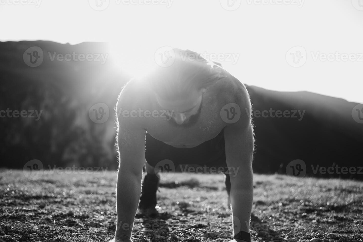 Athlete doing push-ups in the early morning. The concept of a healthy life photo