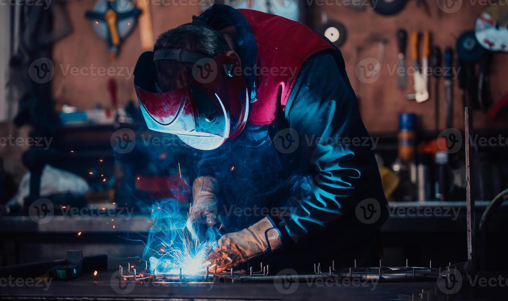 Welder erecting technical steel. Industrial steel welder in factory technical photo