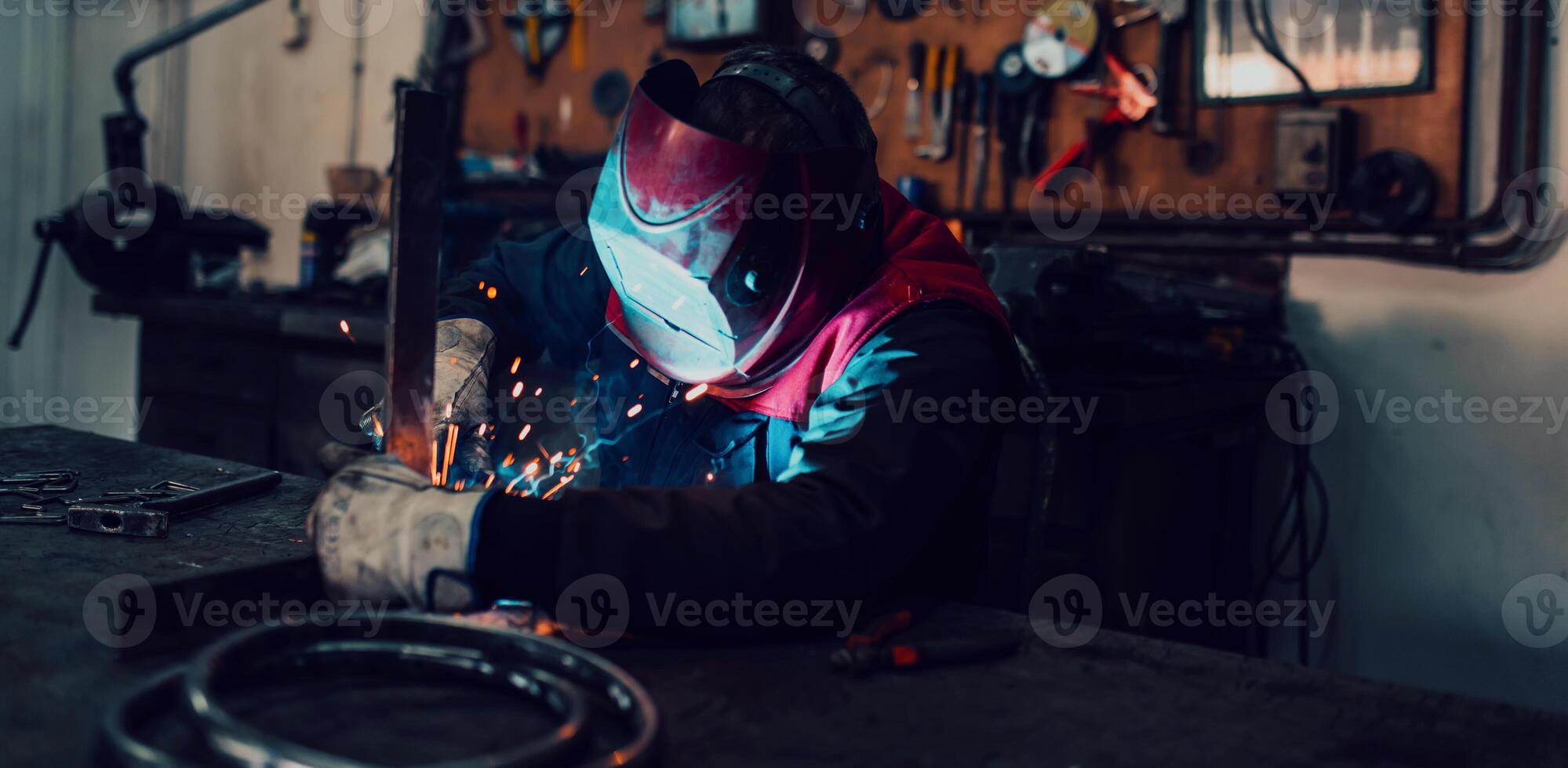Welder erecting technical steel. Industrial steel welder in factory technical photo