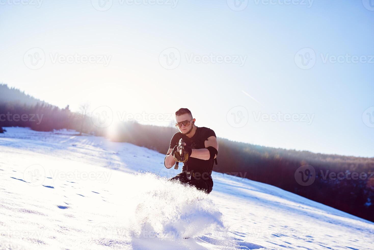 soldier with weapons in forest somewhere above the Arctic Circle photo