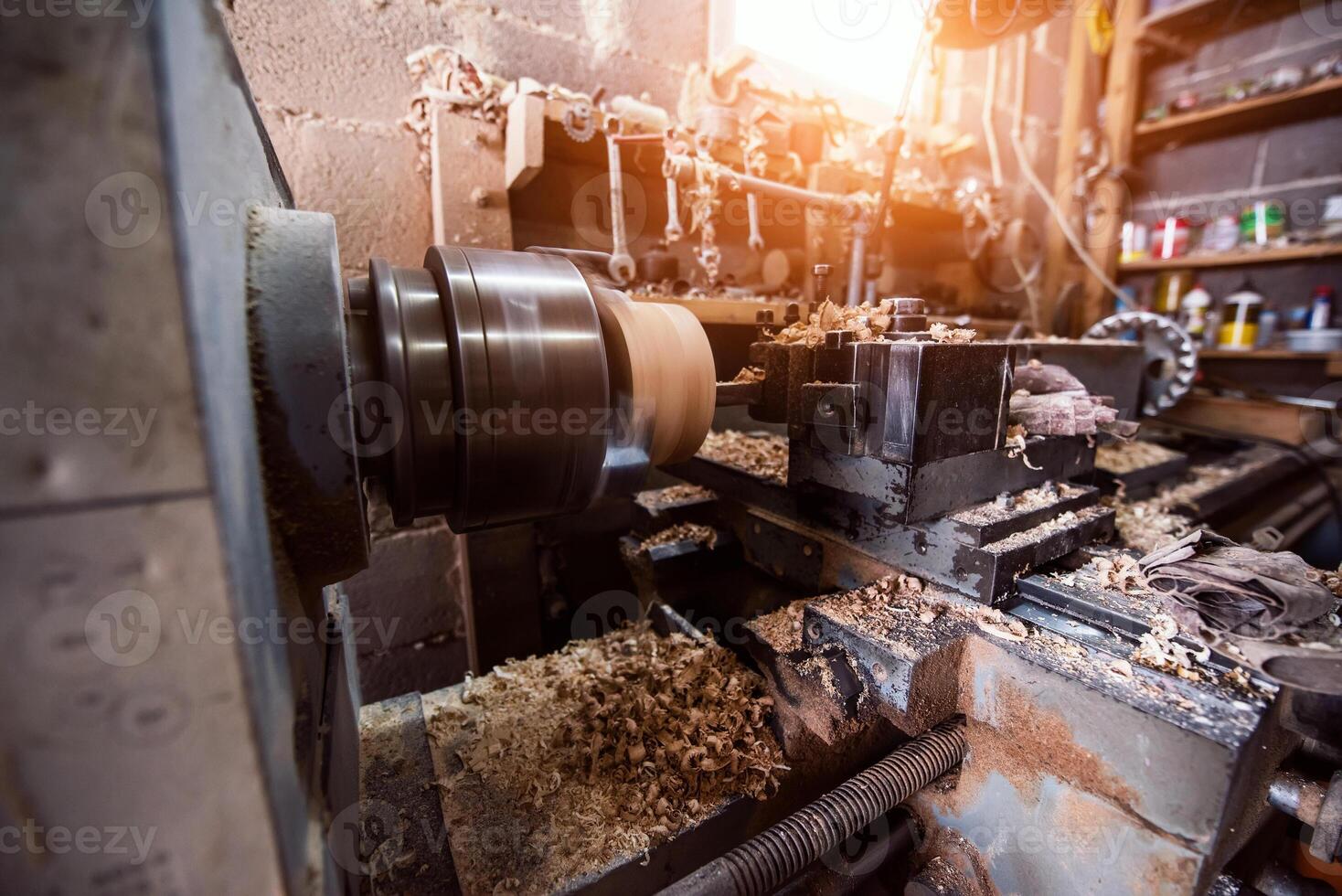 Close-up photo of a lathe working on wood. Mechanical processing of wood