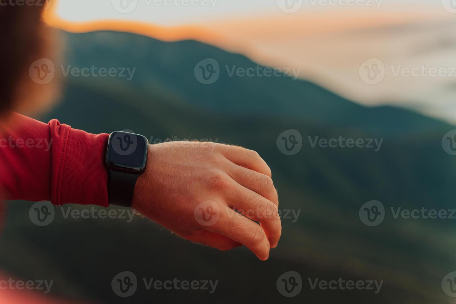 Man Using A Digital Smartwatch During Workout. Closeup View Of Man's Hands Checking An App In Smartwatch. Close-up Of A Clock That Shows Steps, Kilometers And bpm. photo