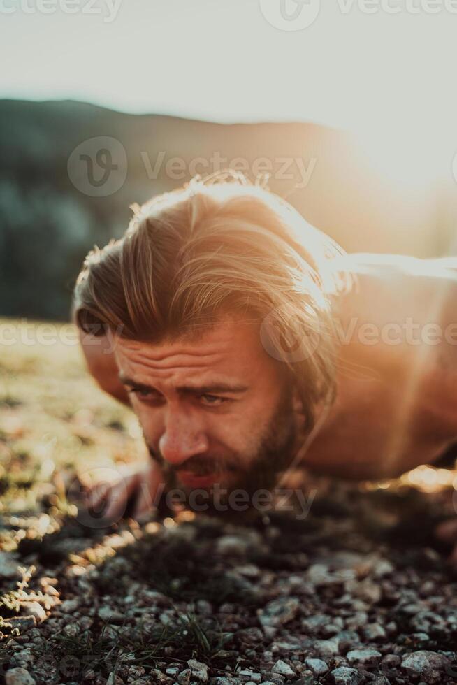 Athlete doing push-ups in the early morning. The concept of a healthy life photo
