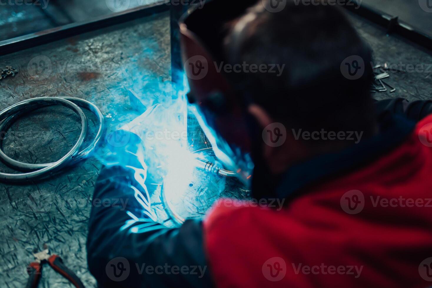 Close up of the steel welding process. Work in the heavy steel industry photo