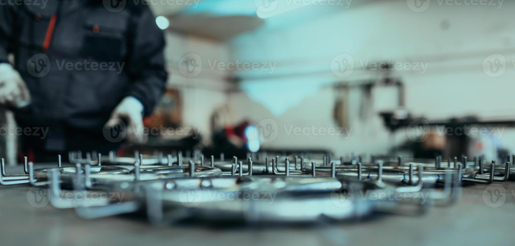 Pieces of steel lined up on the table ready for the welding process photo
