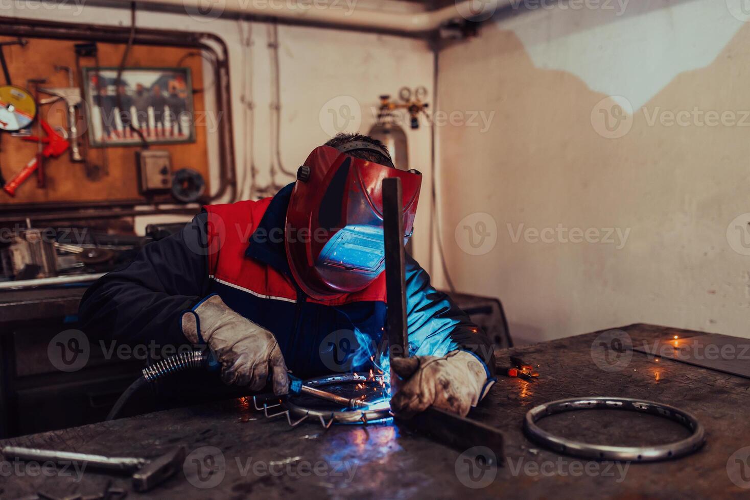 Welder erecting technical steel. Industrial steel welder in factory technical photo