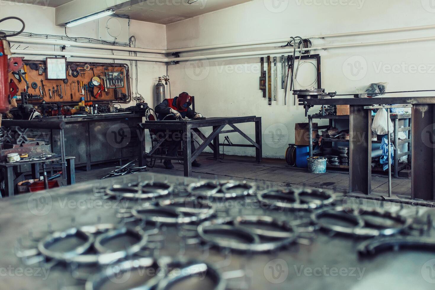 Pieces of steel lined up on the table ready for the welding process photo