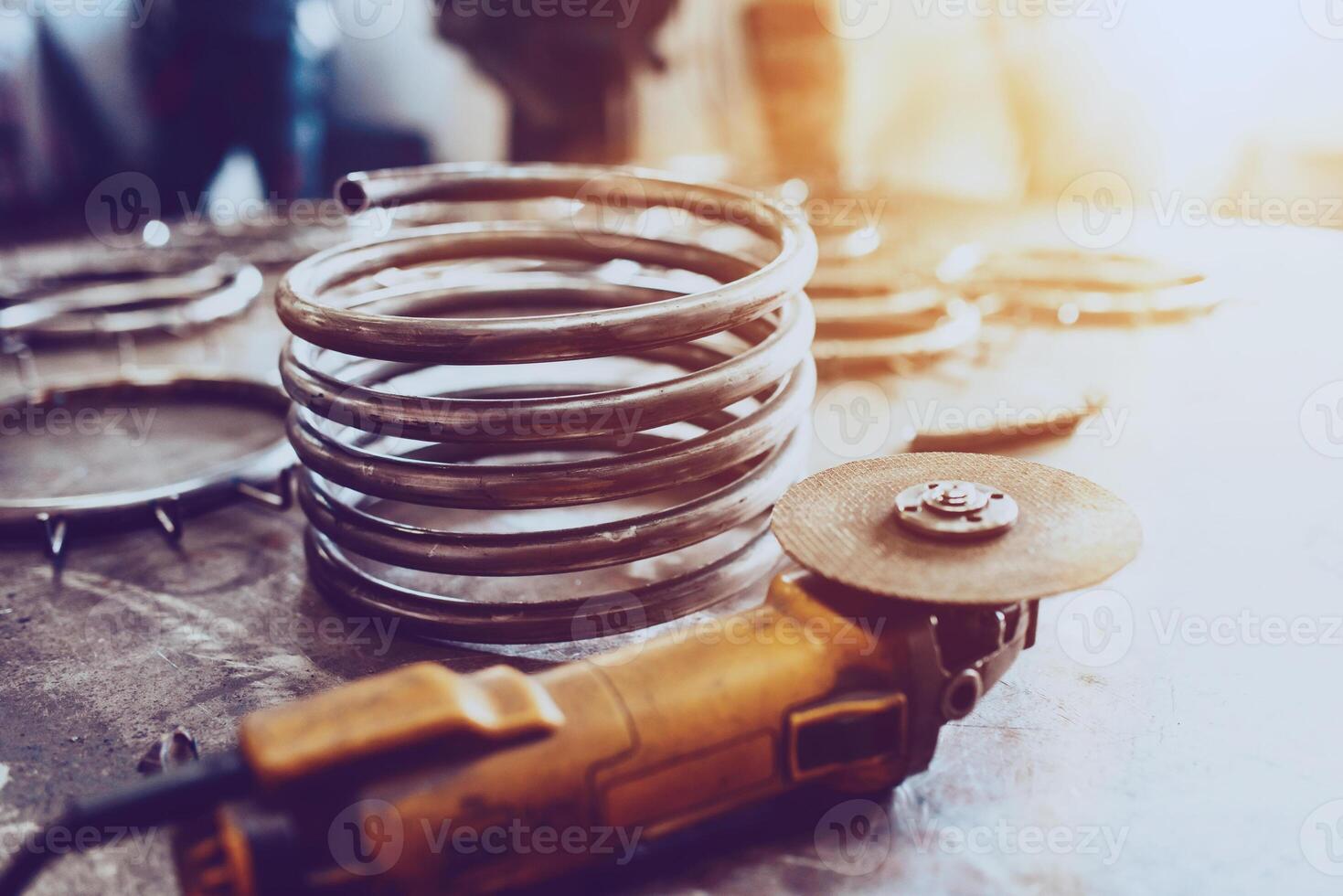 Pieces of steel lined up on the table ready for the welding process photo