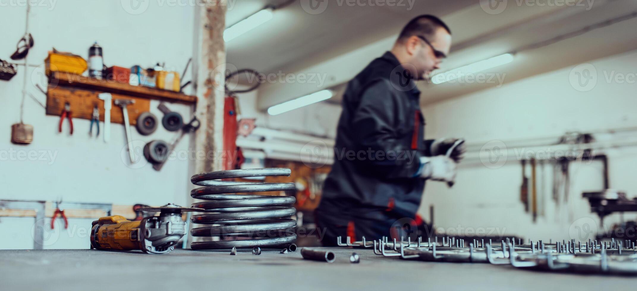 Pieces of steel lined up on the table ready for the welding process photo