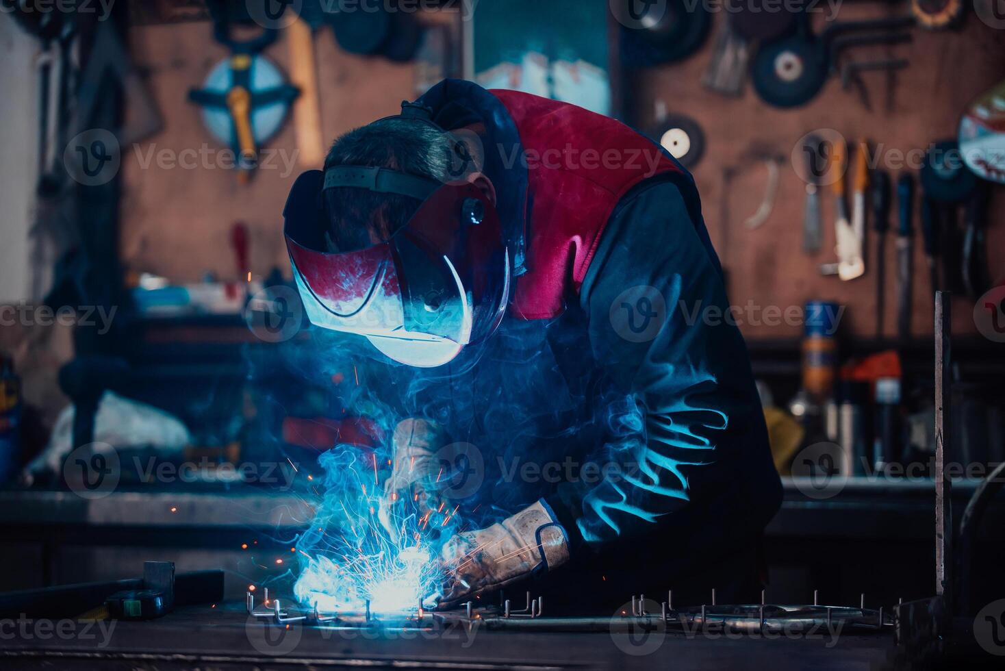 Welder erecting technical steel. Industrial steel welder in factory technical photo