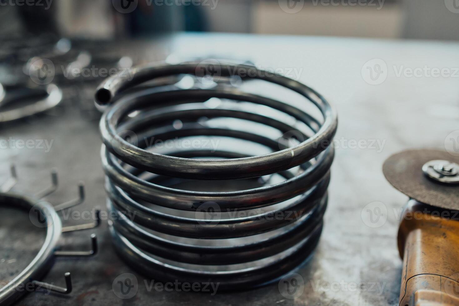 Pieces of steel lined up on the table ready for the welding process photo