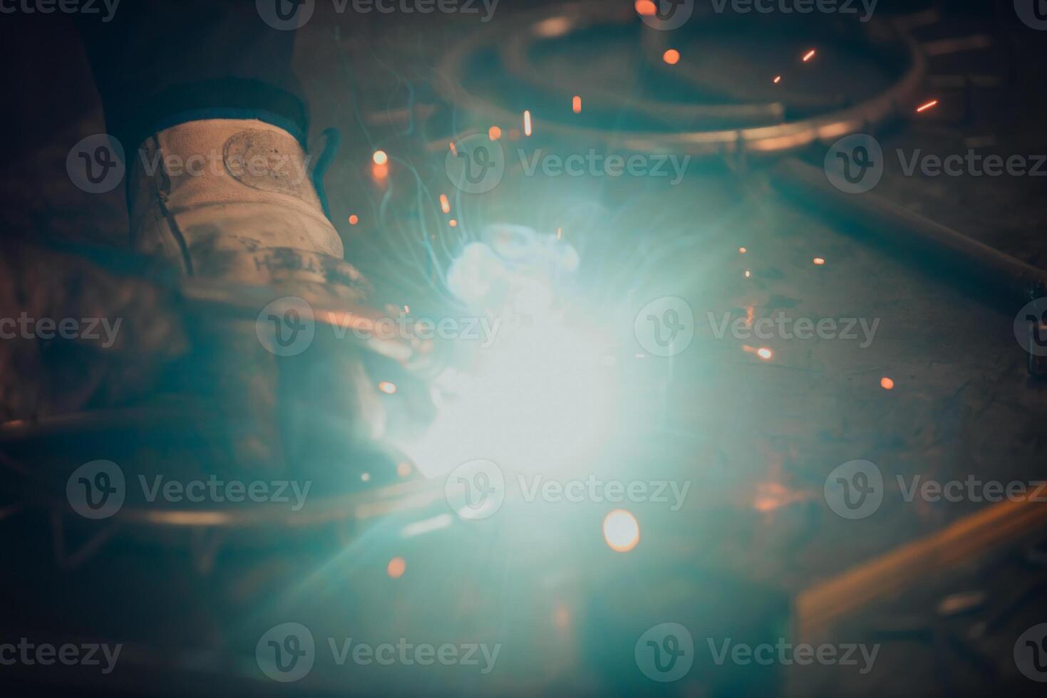 Close up of the steel welding process. Work in the heavy steel industry photo