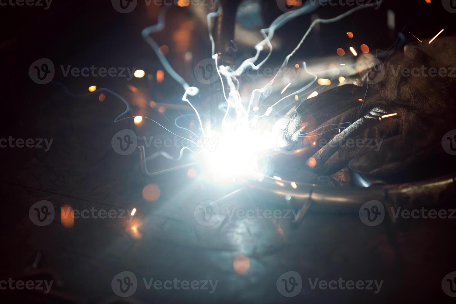 Close up of the steel welding process. Work in the heavy steel industry photo