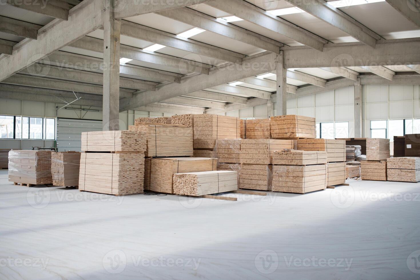 A vast warehouse in the forestry industry, showcasing a plethora of wooden products, including boards and various timber items neatly organized in storage photo
