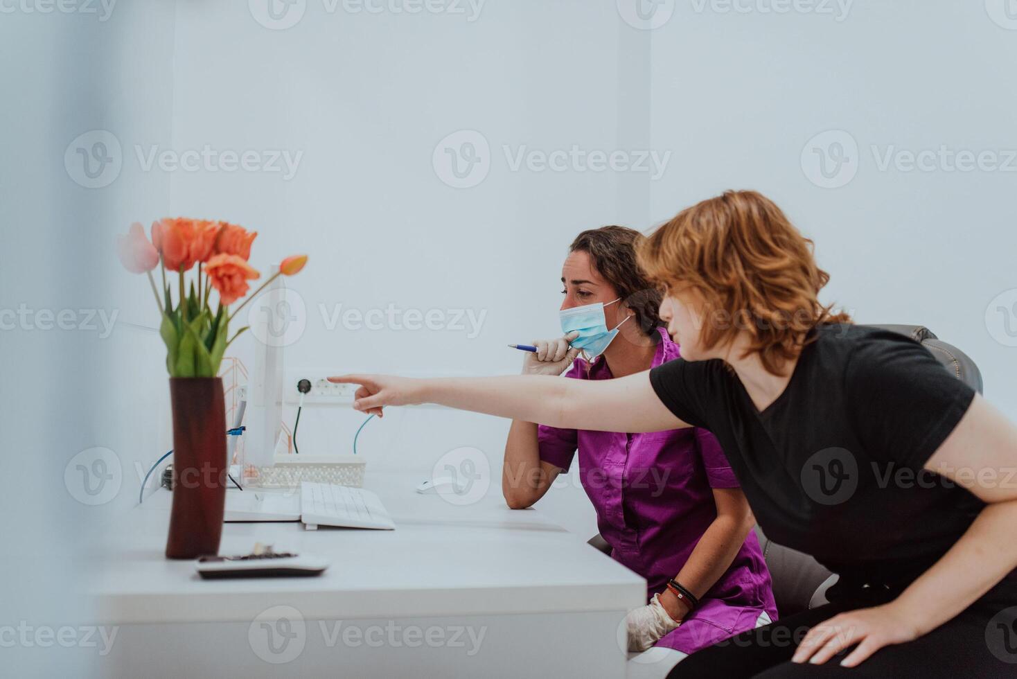 In a modern dental office, a dentist and a young patient engage in a collaborative consultation, exploring new tooth shades and discussing treatment options using a computer photo