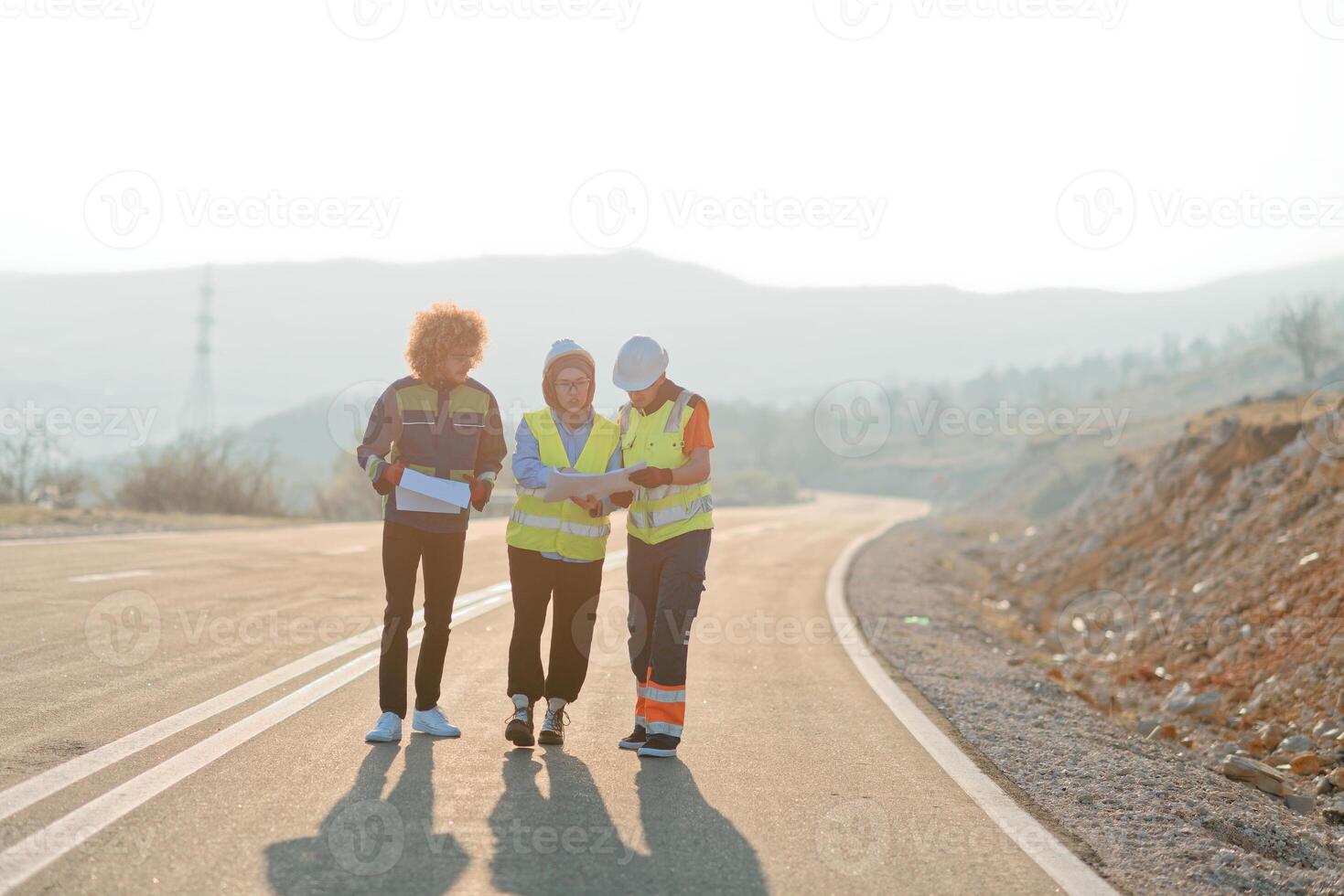 A team of engineers and workers oversees a wind turbine project at a modern wind farm, working together to ensure the efficient generation of renewable energy photo