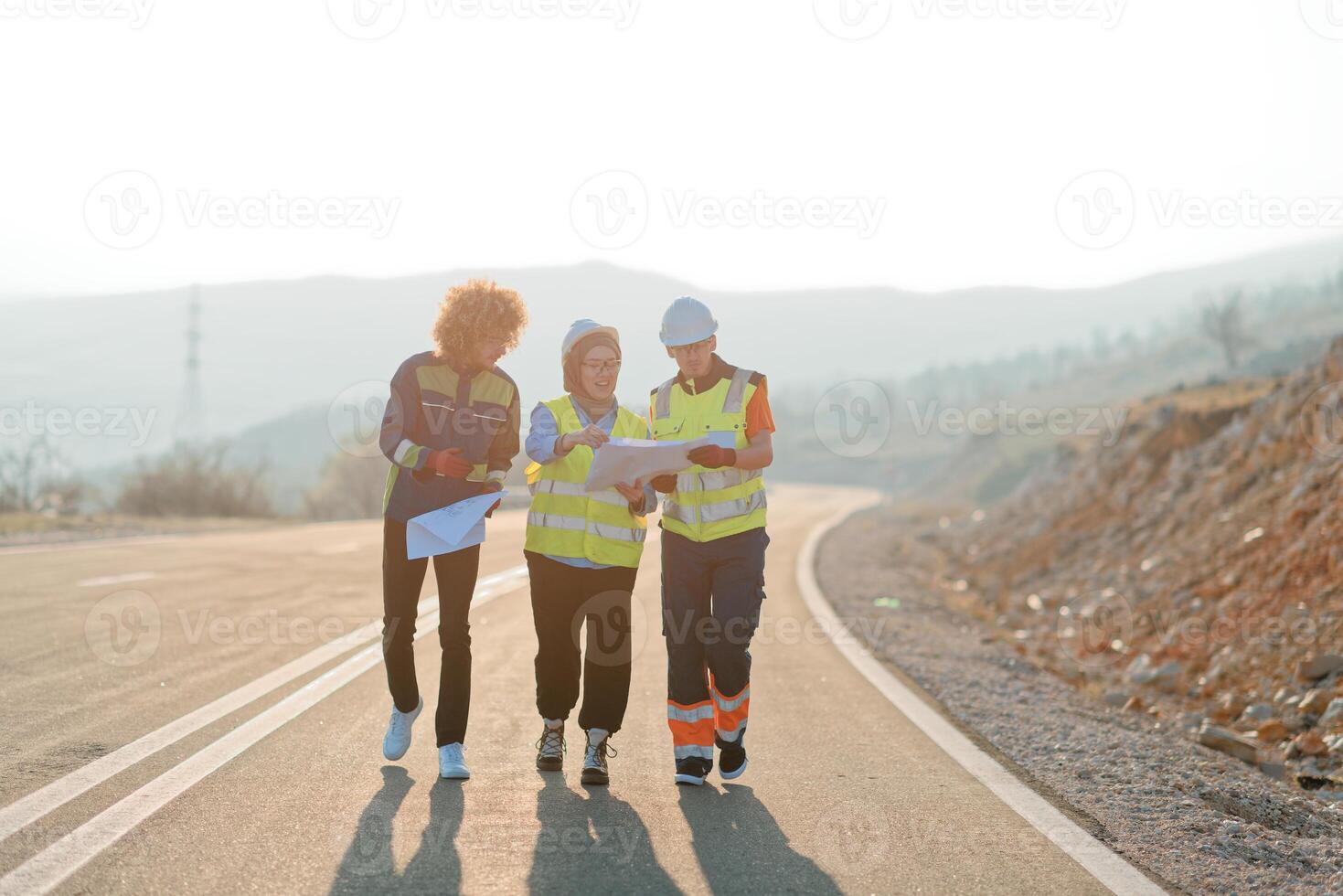 A team of engineers and workers oversees a wind turbine project at a modern wind farm, working together to ensure the efficient generation of renewable energy photo
